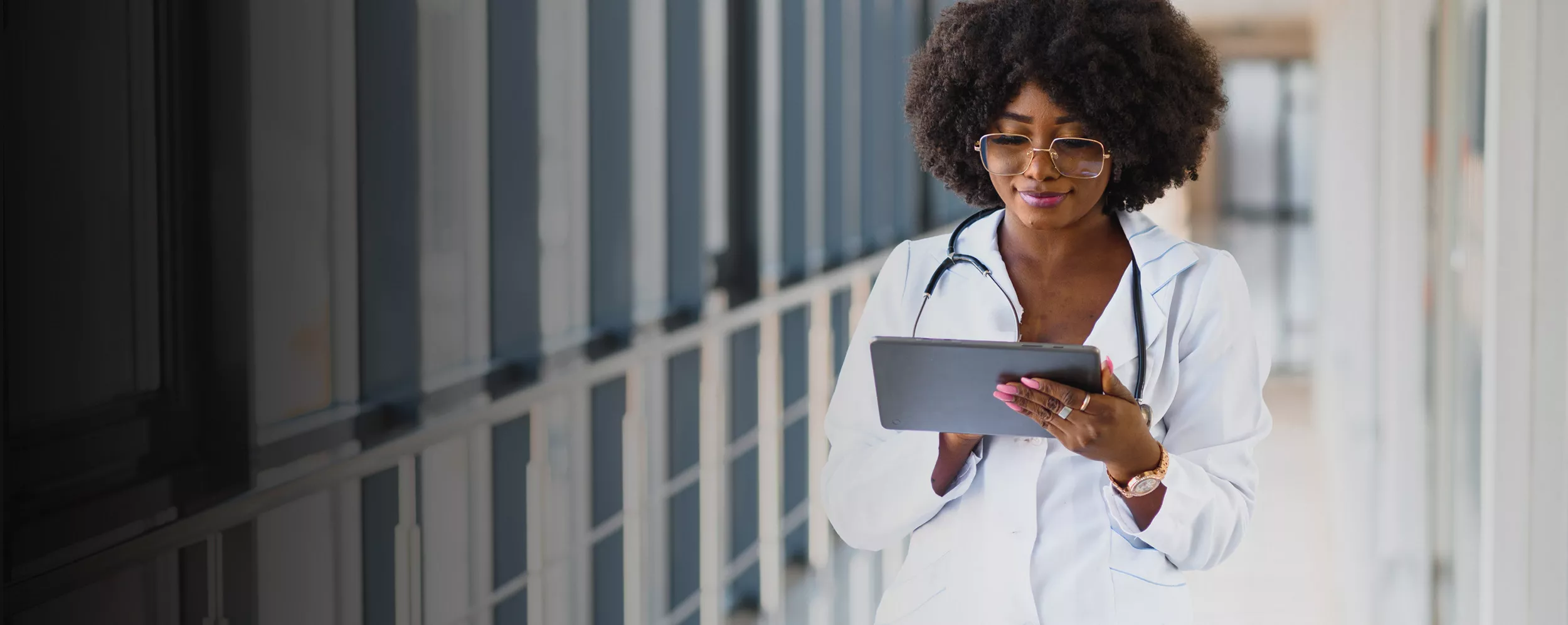 Female doctor working with a tablet.
